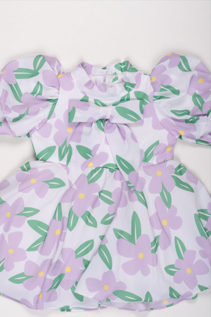 The Nesavu Girls Fancy Frock Purple Blossom Frock with Sparkling Brooch for Girls Nesavu Girls Lavender Floral Frock | Cheerful Spring Dress with Brooch | The Nesavu