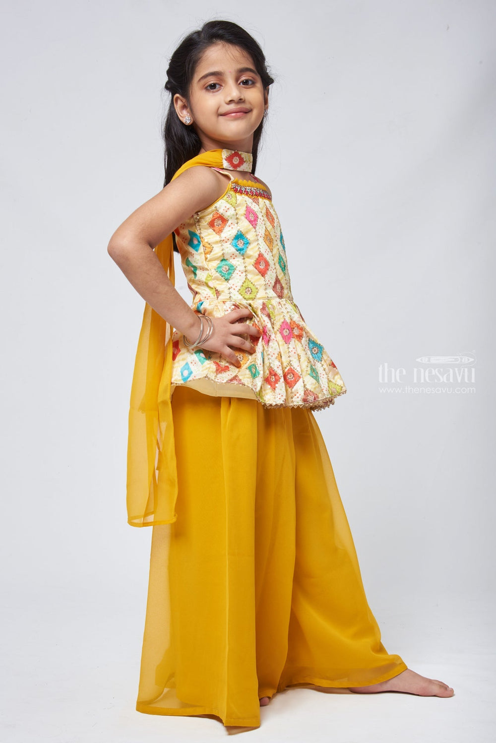 The Nesavu Girls Sharara / Plazo Set Radiant Sequins Embroidered Multicolor Peplum Kurti paired with Sunny Yellow Palazzo: Ethnic Splendor for Girls. Nesavu Sequins Embroidered Kurti palazzo set | Sets and suits for Girls | The Nesavu