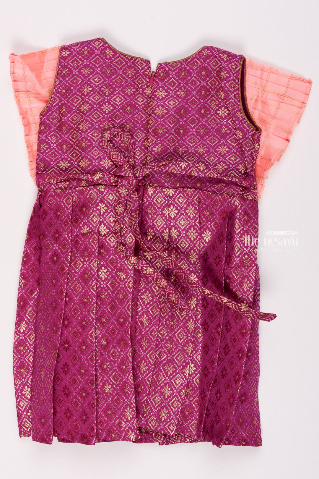 The Nesavu Silk Frock Regal Purple Brocade Elegance Pleated with Salmon Layered Yoke Tradition Meets Modernity for Stylish Girls Nesavu Silk Gown Frock | Silk Pattu Frock Girls | The Nesavu