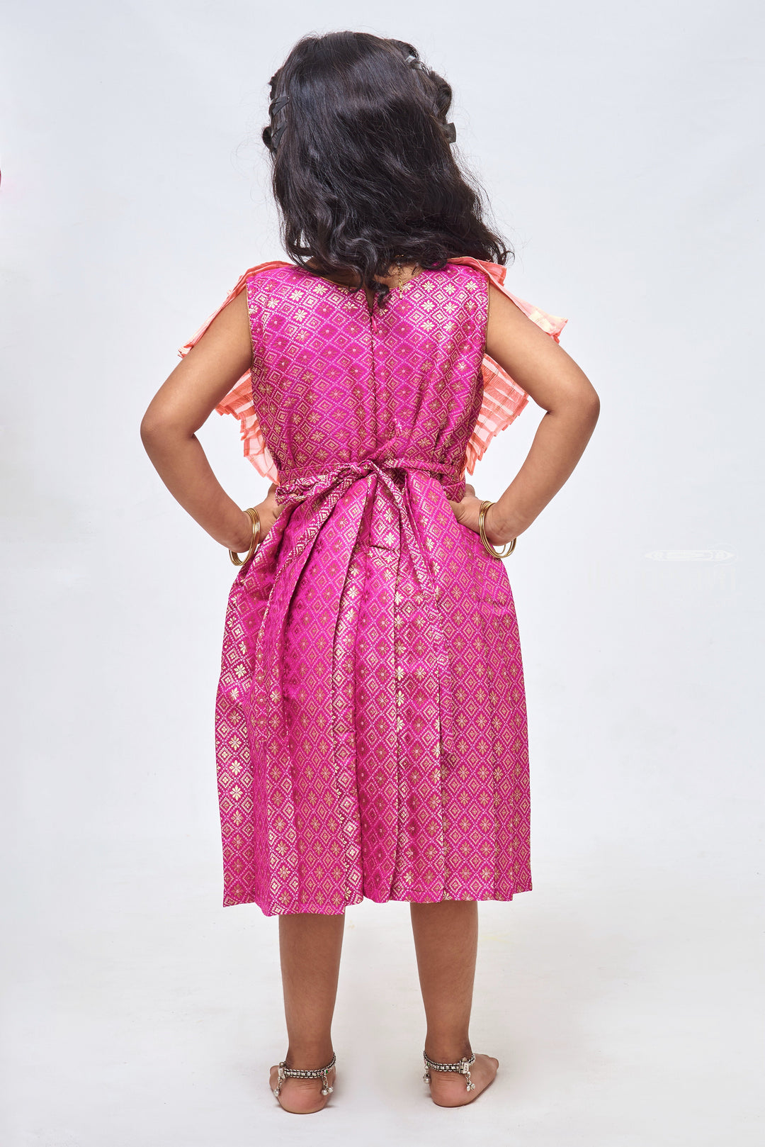 The Nesavu Silk Frock Regal Purple Brocade Elegance Pleated with Salmon Layered Yoke Tradition Meets Modernity for Stylish Girls Nesavu Silk Gown Frock | Silk Pattu Frock Girls | The Nesavu