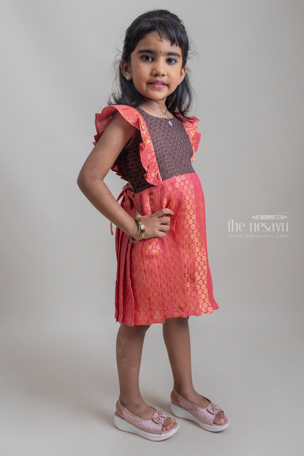 The Nesavu Silk Frock Rich Brown Checked Yoke & Salmon Elegance Brocade Designer Pleated Resham Gown for Girls. Nesavu Premium Silk Frock For Girls | Comfortable Silk Frock |The Nesavu