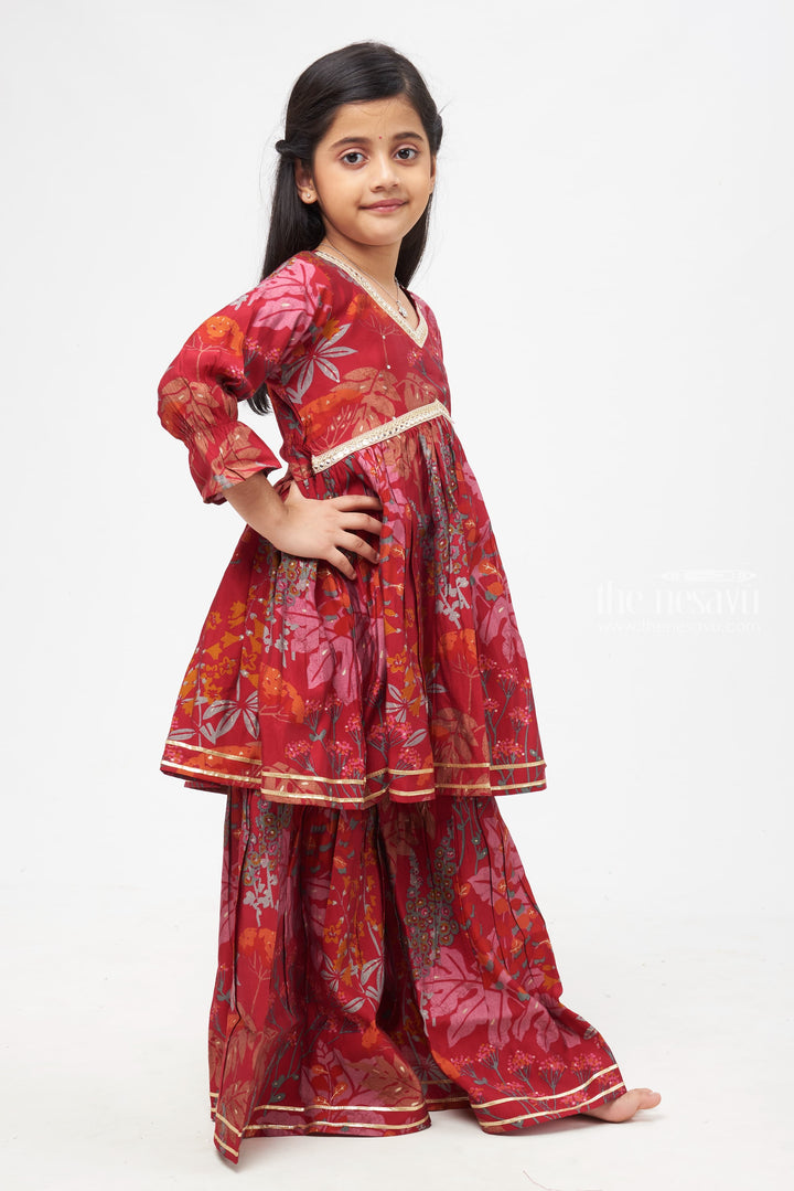 The Nesavu Girls Sharara / Plazo Set Royal Garnet Kurti Suit with Gharara Pants - Enthralling Floral Elegance for Girls Nesavu Girls Garnet Anarkali Suit with Gharara Pants | Intricate Floral Patterns | Luxurious Ethnic Wear for Special Celebrations