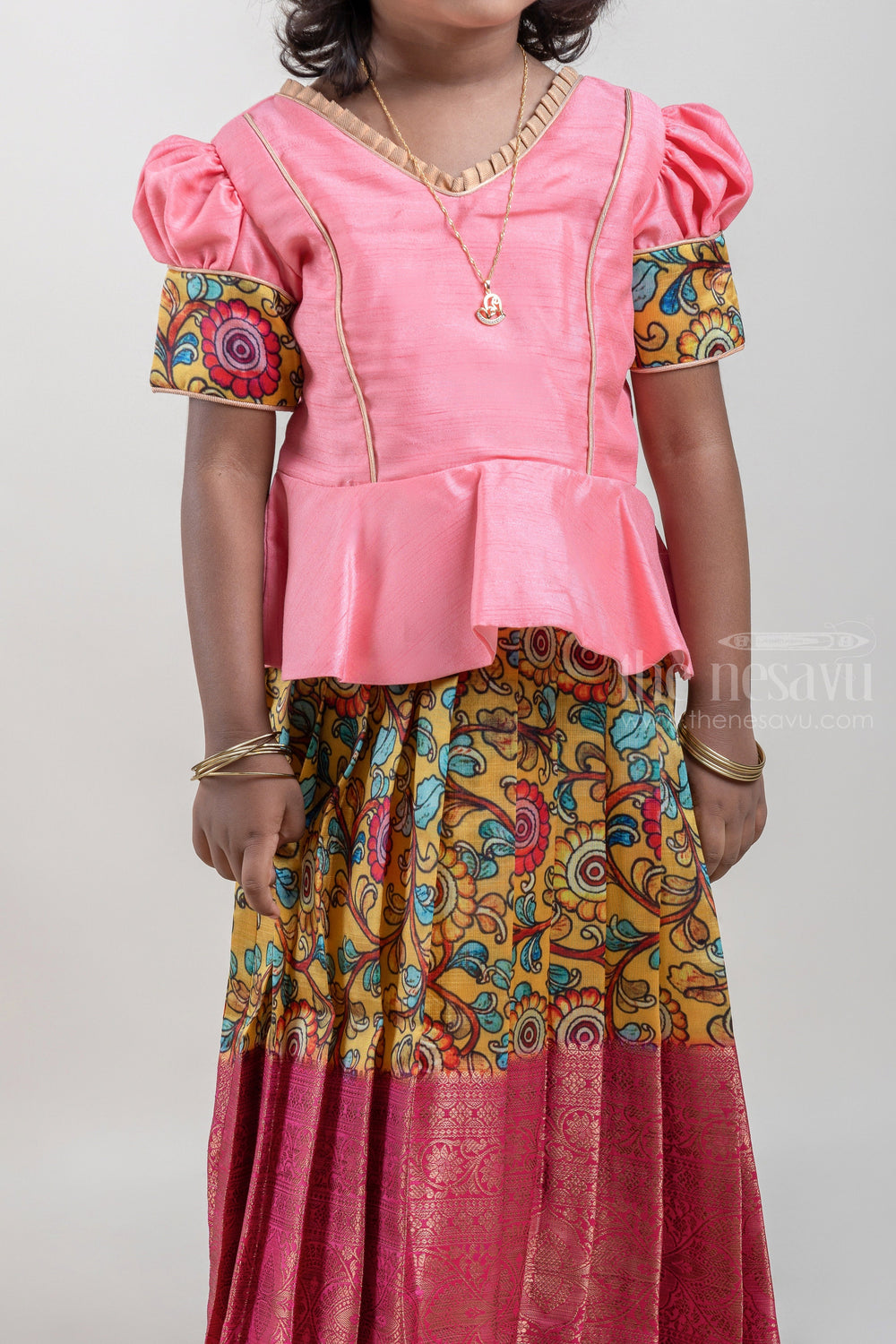 The Nesavu Pattu Pavadai Salmon Pink and Yellow Silk Pattu Pavadai for Girls with Floral Cuffs and Banarasi Border Nesavu Salmon Pink and Yellow Silk Pattu Pavadai for Girls at The Nesavu | Traditional Indian Outfit