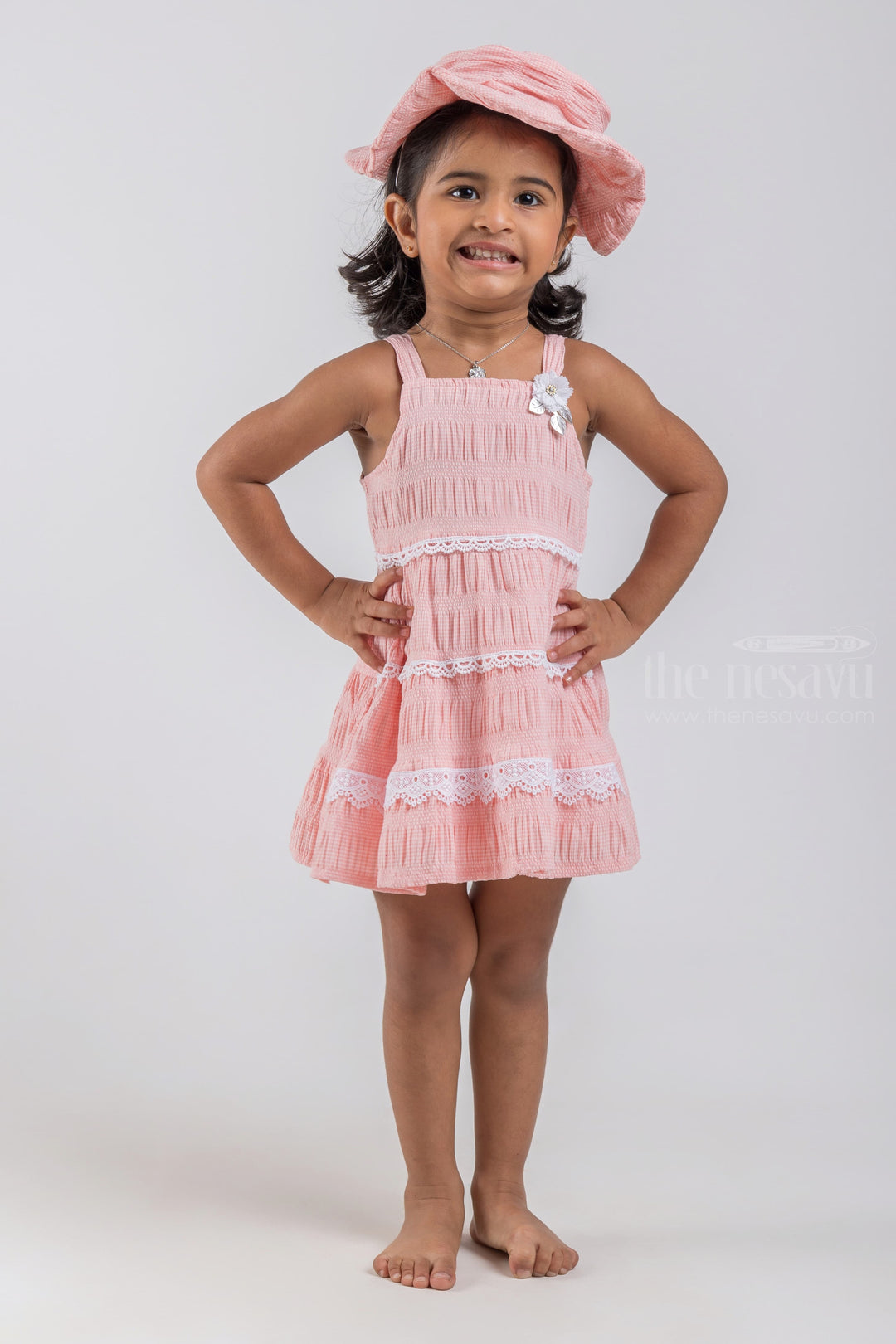 The Nesavu Baby Cotton Frocks Salmon Pink Sleeveless Layered Cotton Frock with Embellished Lace and Flower Applique for Baby Girls and Cap psr silks Nesavu