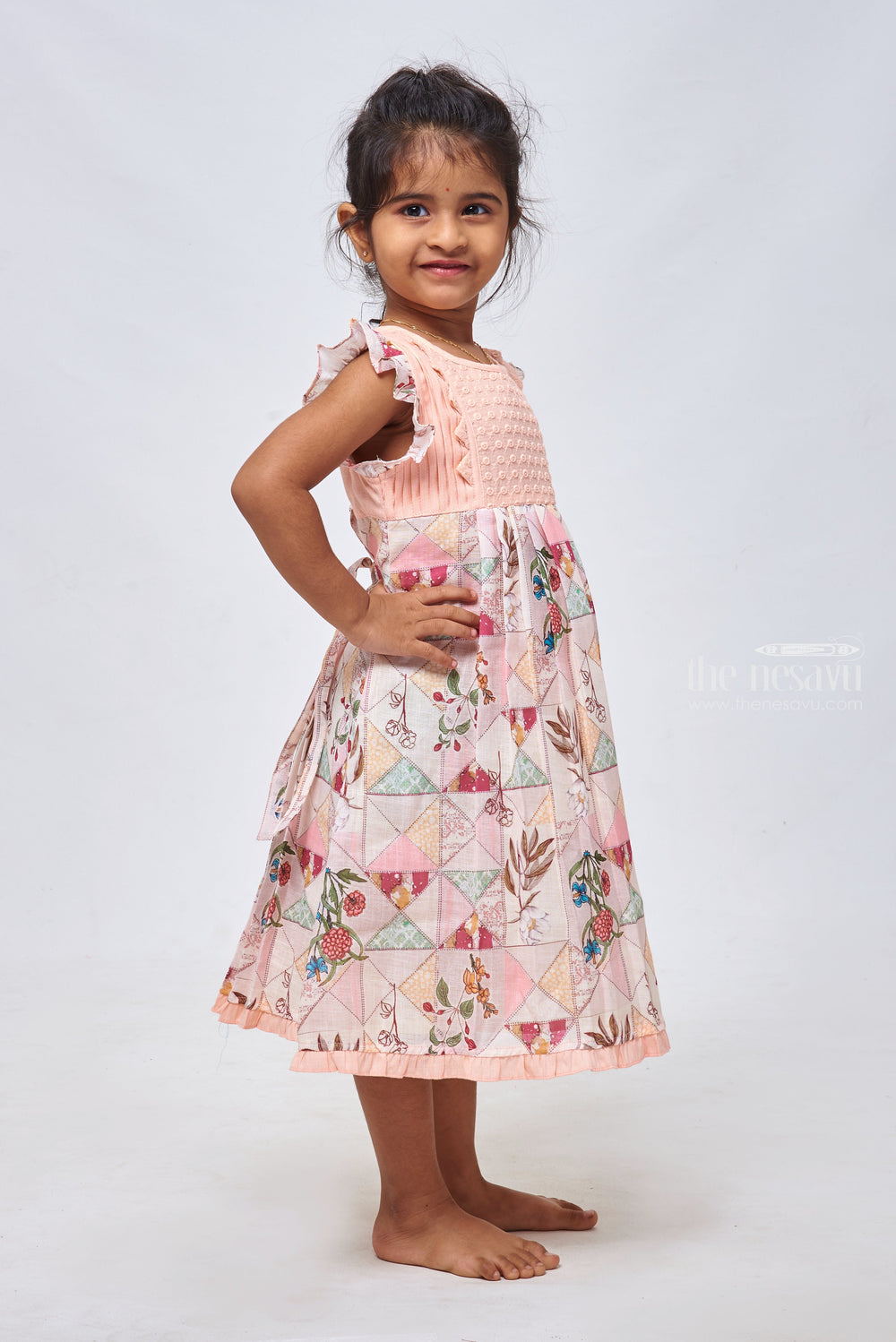 The Nesavu Girls Cotton Frock Salmon Sunset: Knief Pleated Salmon Cotton Frock with Geometric Print Nesavu Designer Baby Frocks: Elegant Cotton & Crochet Dresses for Girls | The Nesavu