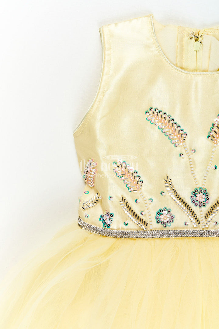 The Nesavu Girls Party Gown Satin and net party gown for girls with bead embroidery Nesavu Nesavu girls yellow party gown with satin bodice and embroidered net flare
