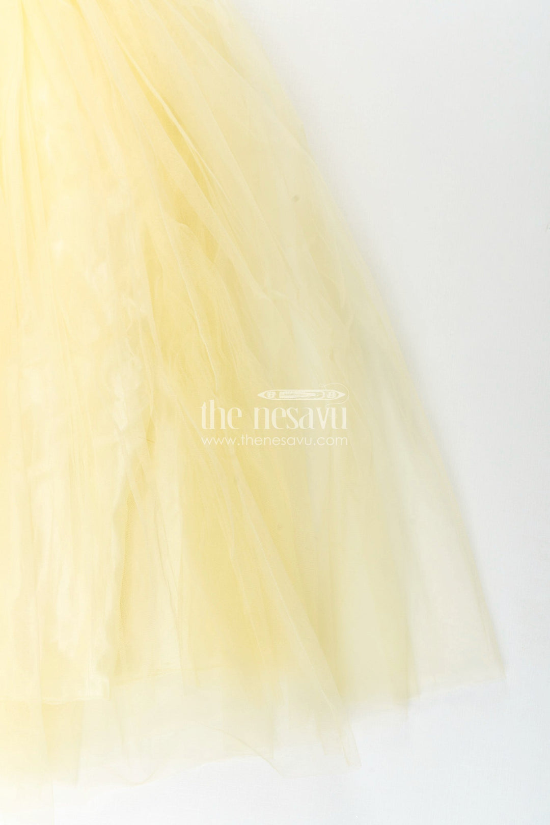 The Nesavu Girls Party Gown Satin and net party gown for girls with bead embroidery Nesavu Nesavu girls yellow party gown with satin bodice and embroidered net flare