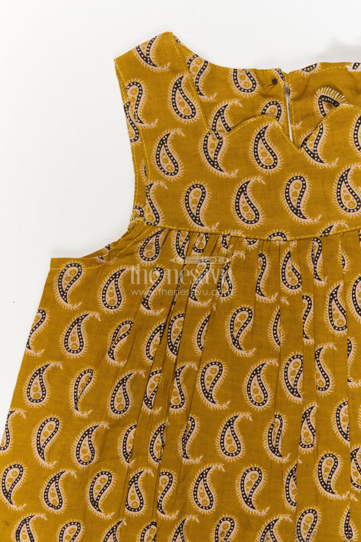 The Nesavu Girls Cotton Frock Sleeveless Cotton Frock for Girls with Yellow Paisley Print Nesavu Nesavu yellow cotton frock for girls with paisley digital print – sleeveless summer outfit
