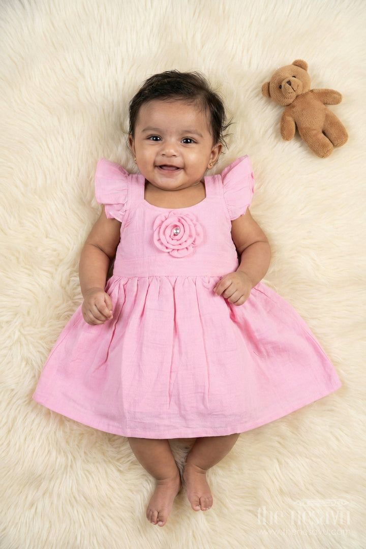 The Nesavu Girls Cotton Frock Soft Cotton Frock for Baby Girls’ Playful Outings Nesavu 14 (6M) / Pink / Muslin Cotton BFJ917C-14 Nesavu baby girl cotton frock with rosette detail and flutter sleeves for casual wear