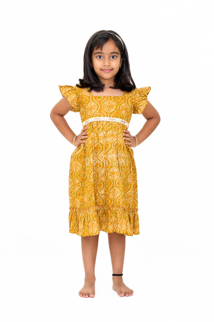 The Nesavu Girls Cotton Frock Solid Cotton Dress for Girls in Mustard with Ruffle and Lace Details Nesavu Nesavu Solid Cotton Dress Girls Lace Waistband Ruffle Hem Mustard