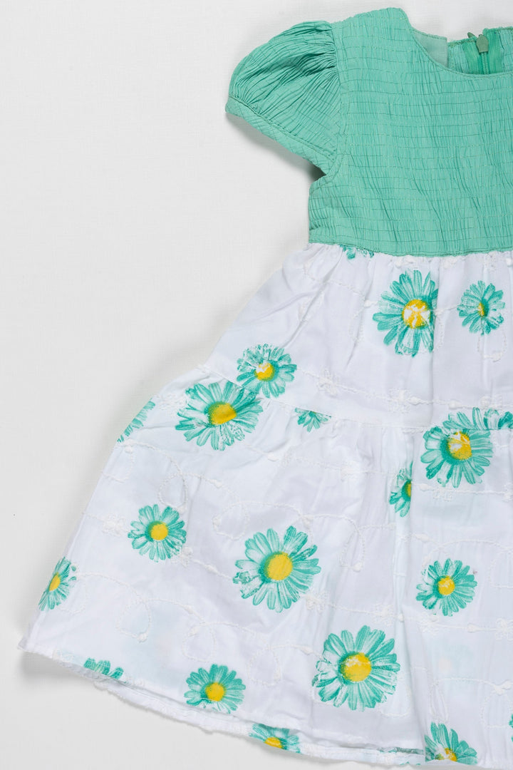 The Nesavu Girls Cotton Frock Springtime Blossom Girls Green Cotton Frock with Floral Accents Nesavu Girls Green Floral Print Cotton Frock | Perfect for Spring/Summer | The Nesavu