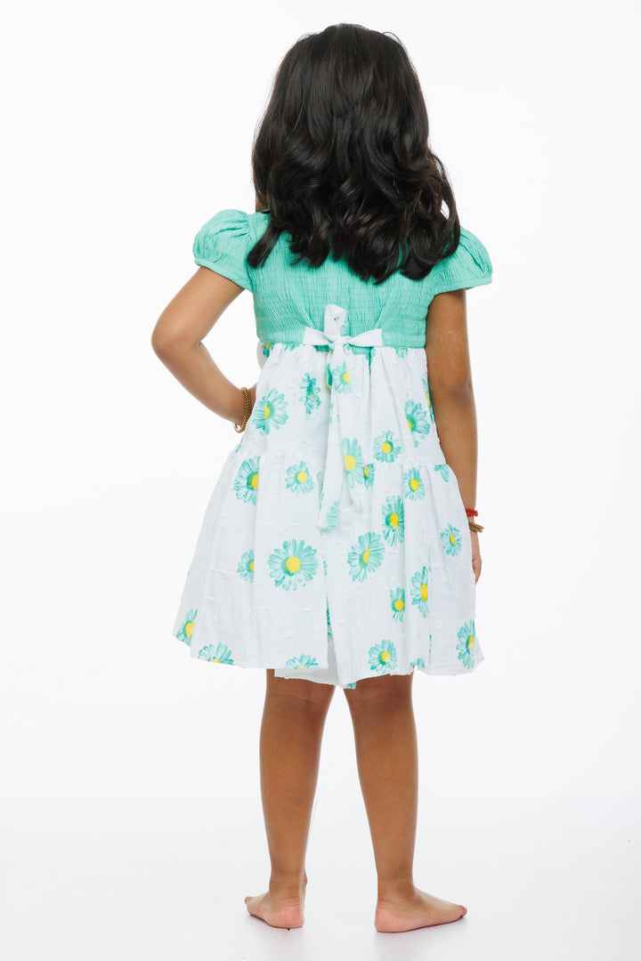 The Nesavu Girls Cotton Frock Springtime Blossom Girls Green Cotton Frock with Floral Accents Nesavu Girls Green Floral Print Cotton Frock | Perfect for Spring/Summer | The Nesavu