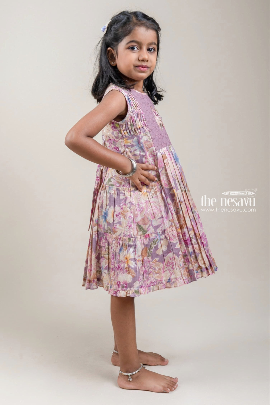 The Nesavu Girls Cotton Frock Stunning Purple Floral Printed Pleated Girls Cotton Frock With Bow Applique Nesavu Girls Frock Suit | Trendy Cotton Frock Collection | The Nesavu