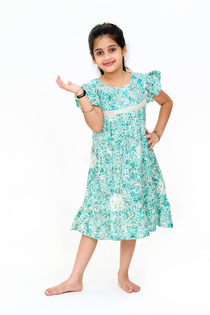 The Nesavu Girls Cotton Frock Stylish Girls Cotton One Piece Dress with Floral Print and Ruffle Hemline Nesavu Nesavu Girls Cotton One Piece Dress Floral Print Ruffles Lace Detailing Summer Style