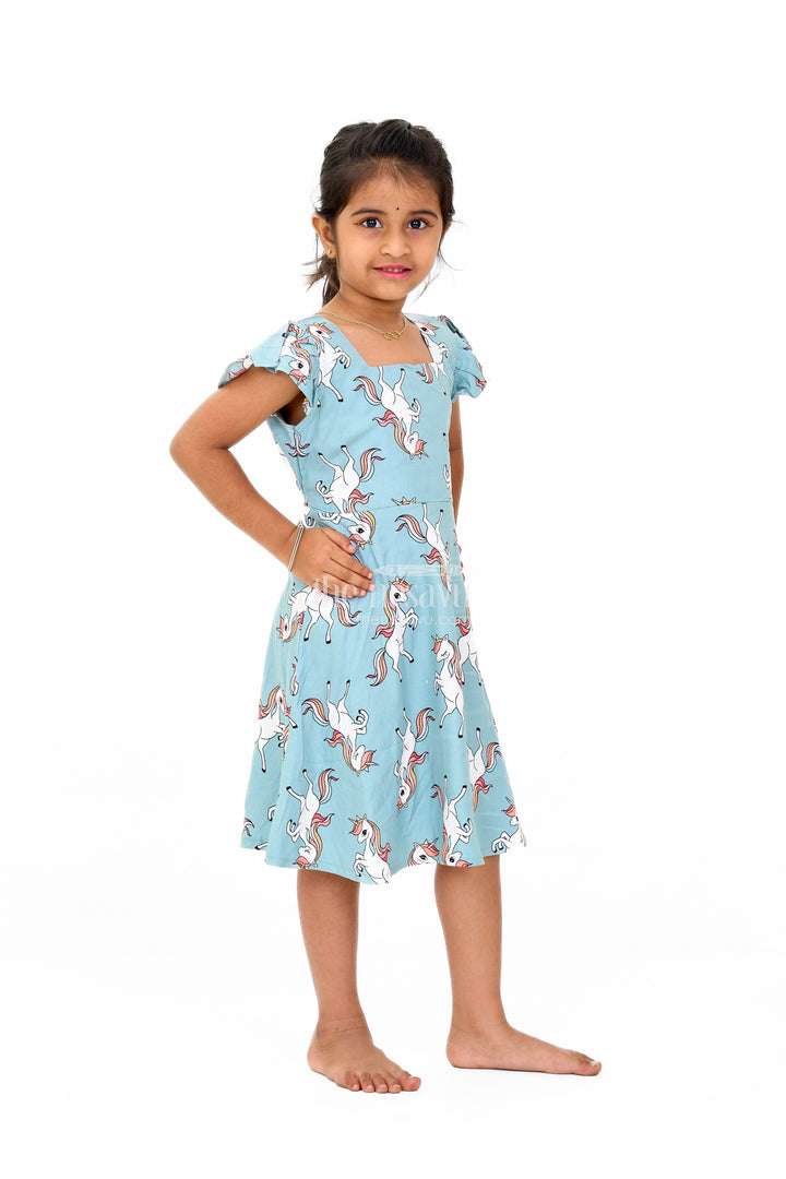 The Nesavu Girls Cotton Frock Stylish Girls Cotton Straight Dress with Unicorn Print and Ruffled Sleeves Nesavu Nesavu Girls Cotton Straight Dress Unicorn Print Ruffled Sleeves Teal Finish