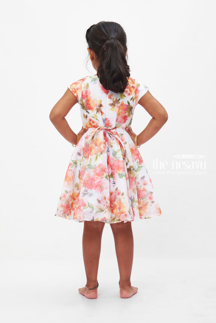 The Nesavu Girls Fancy Frock Summer Bloom Elegance Dress: Vibrant Floral Printed Frock for Girls with Bow Accent Nesavu Girls Floral Summer Dress | White Frock with Vivid Flowers | Playful Bow Detail | The Nesavu