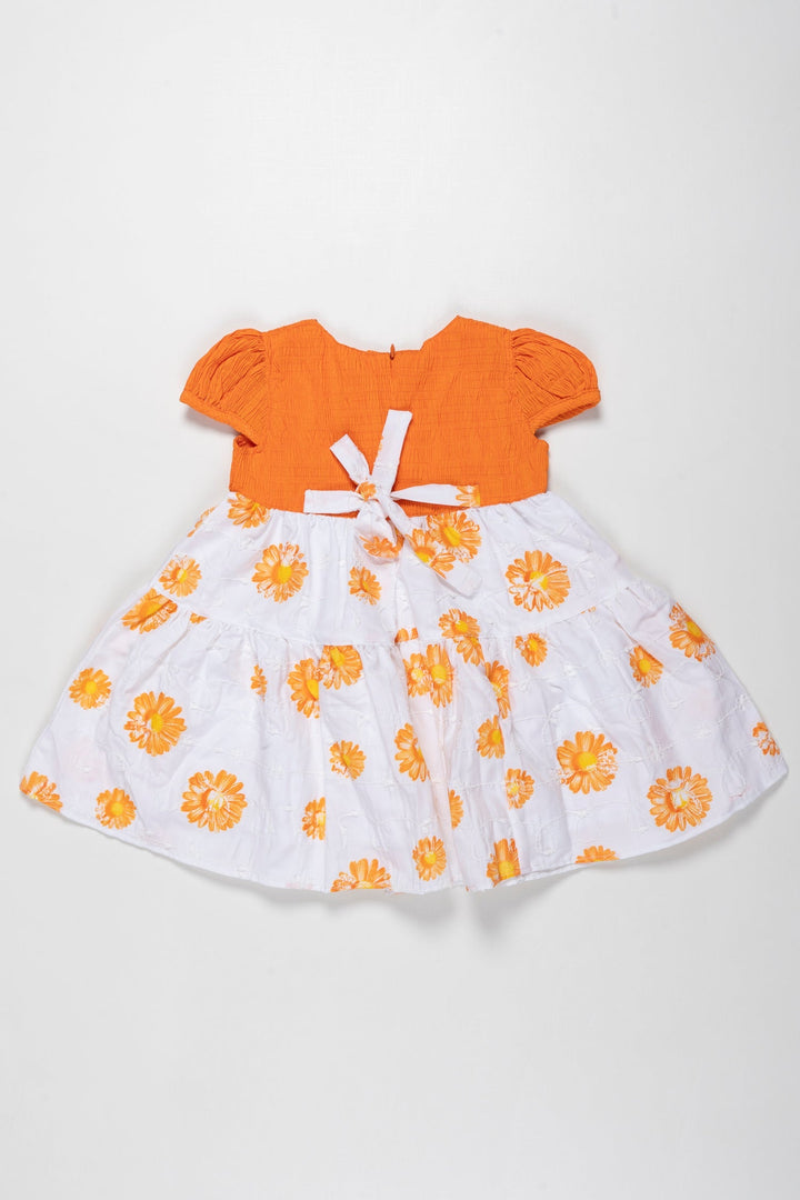 The Nesavu Girls Cotton Frock Sunkissed Delight Orange Cotton Frock with Floral Print for Girls Nesavu Girls Orange Floral Pure Cotton Summer Frock | Comfortable & Stylish | The Nesavu