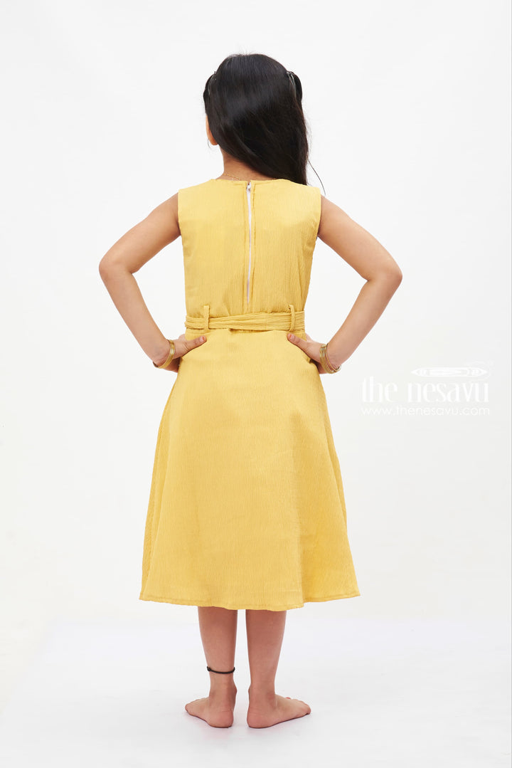The Nesavu Girls Fancy Frock Sunny Yellow Bow Detail Cotton Dress: Bright and Beautiful for Girls Nesavu Girls' Vibrant Yellow Cotton Dress | Sleeveless Bow Frock | The Nesavu