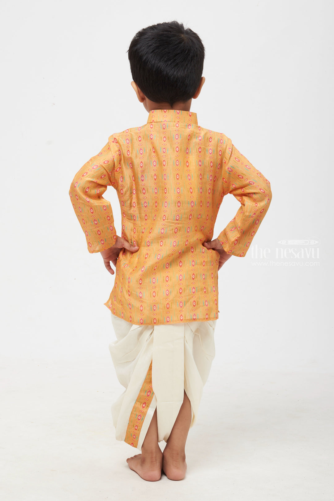 The Nesavu Boys Dothi Set Sunrise Splendor: Captivating Ikat Print Orange Kurta with Classic White Dhoti for Boys Nesavu Premium & Latest Boys Kurta Collection | Traditional Kurta with Dhoti Set | The Nesavu