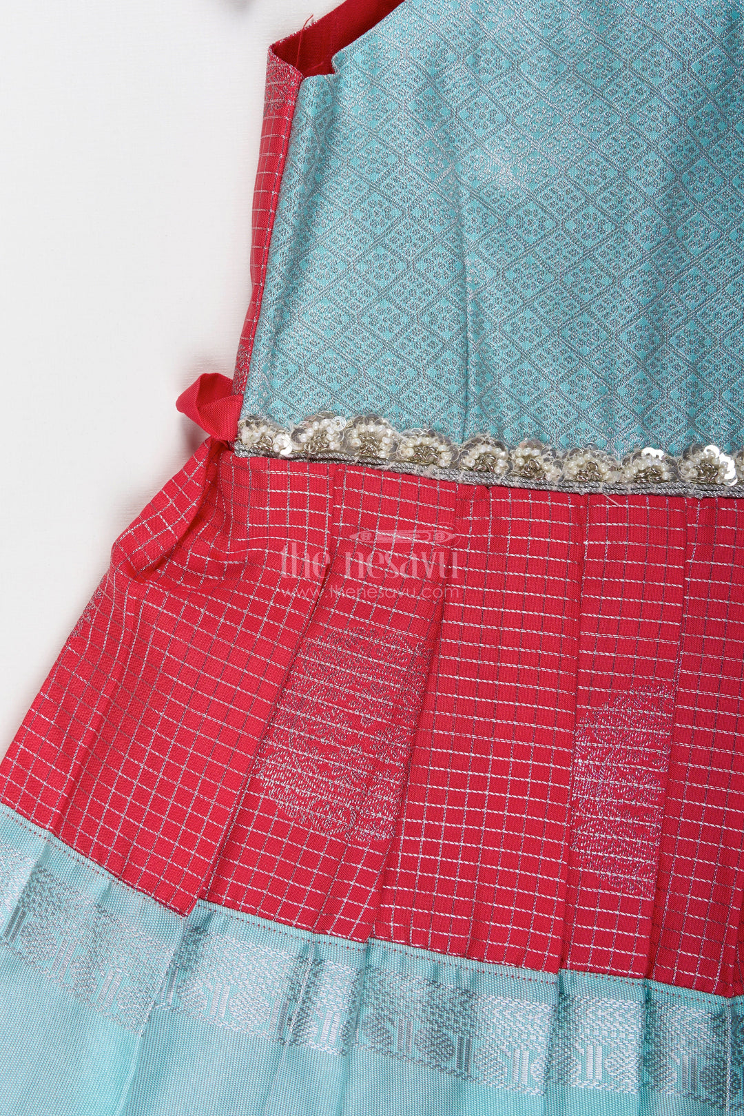 The Nesavu Tie-up Frock Teal and Red Ethnic Frock for Baby Girls Festive Semi Silk Dress with Zari Detailing Nesavu Nesavu Teal And Red Semi Silk Frock For Baby Girls Festive Ethnic Dress With Silver Zari