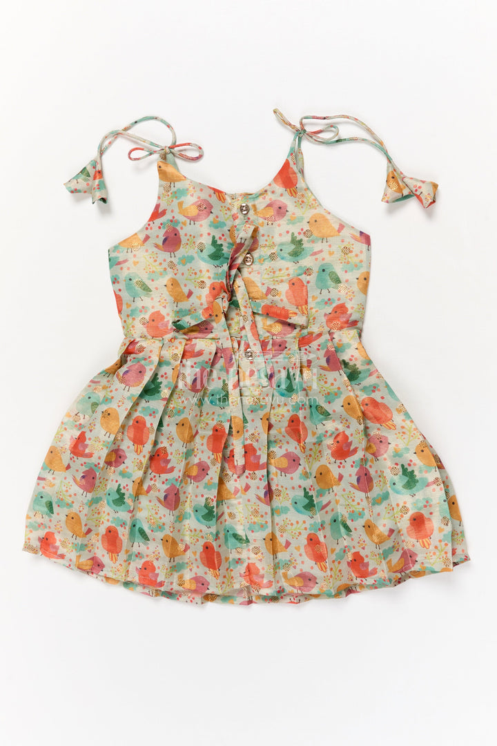 The Nesavu Tie-up Frock Toddler Girl Art Silk Frock for Everyday Wear and Outings Nesavu Nesavu toddler girl everyday frock with digital print and tie-up sleeves in art silk