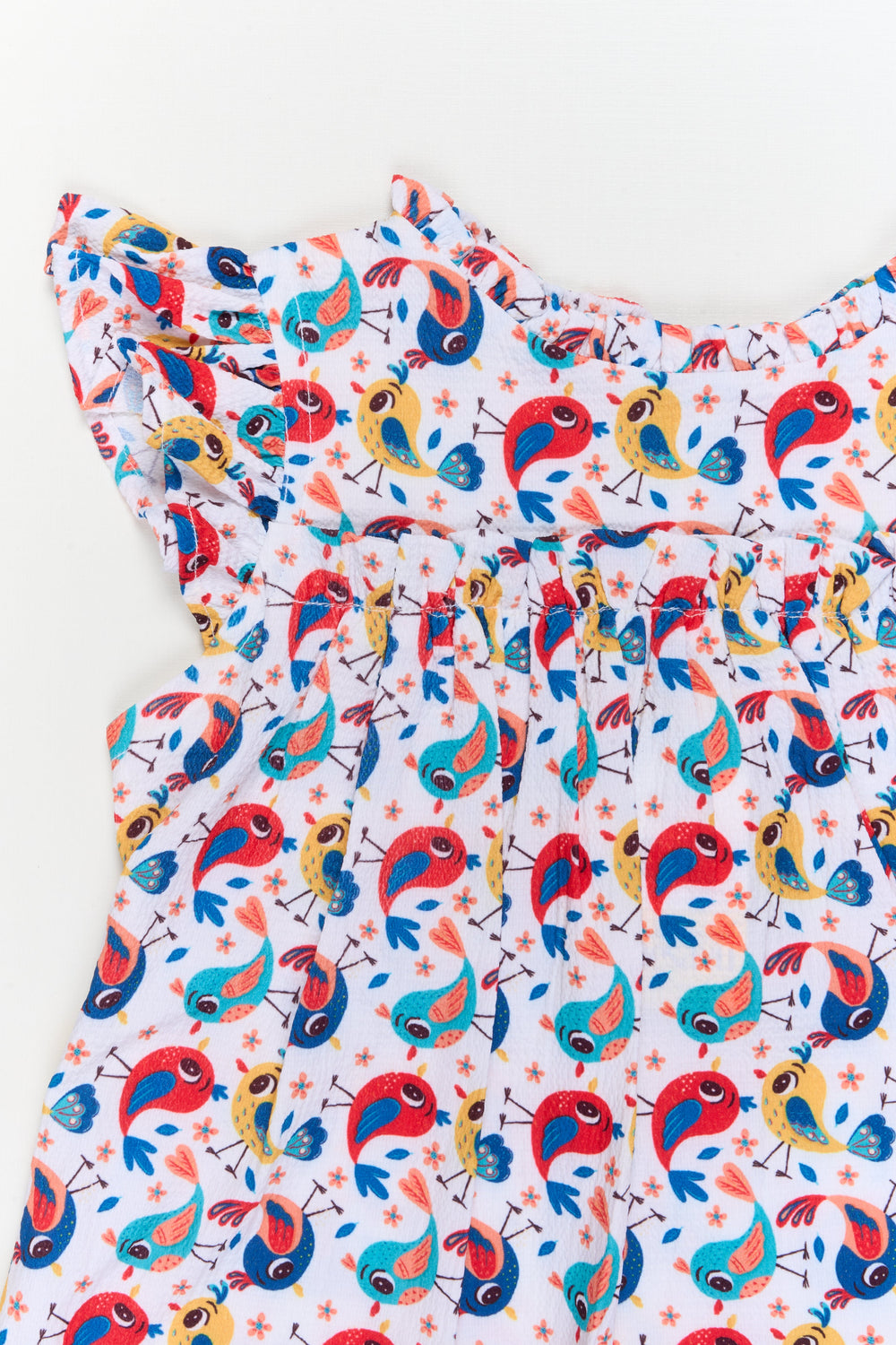 The Nesavu Girls Cotton Frock Toddler Girl Cotton Frock with Parrot Print for Summer Outings Nesavu Nesavu toddler girl cotton frock with playful parrot print for summer and travel wear