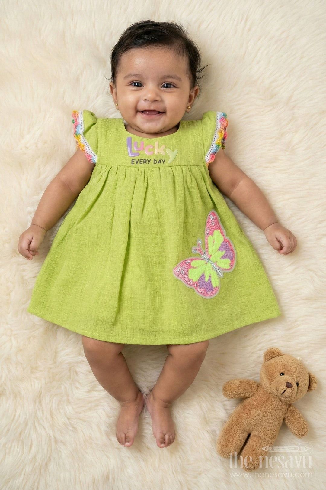 The Nesavu Baby Cotton Frocks Toddler Girl Cotton Frock with Sequin Butterfly Patch for Playful Days Nesavu 14 (6M) / Green BFJ892B-14 Nesavu toddler girl cotton frock with sequin butterfly patch and rainbow trim for everyday fun