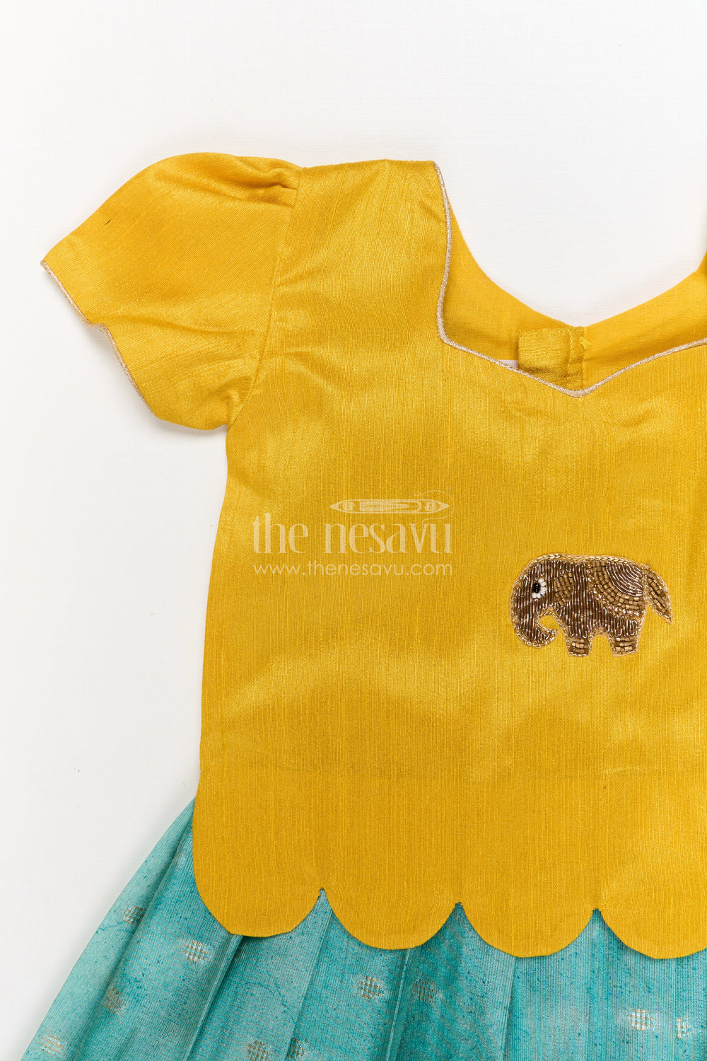 The Nesavu Pattu Pavadai Toddler Girl Pattu Pavadai with Raw Silk Yoke and Art Silk Skirt for Celebration Nesavu Nesavu toddler girl pattu pavadai with raw silk yoke and semi Banaras art silk skirt for family functions