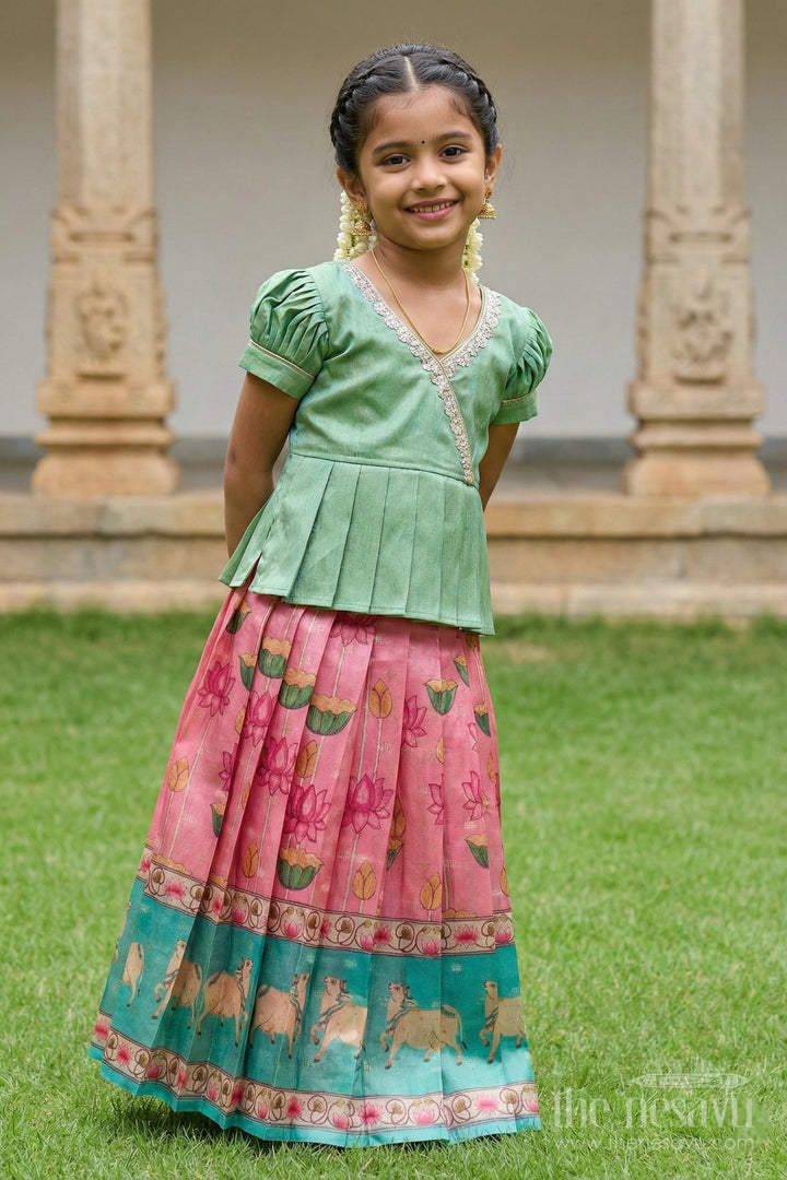 The Nesavu Pattu Pavadai Traditional Baby Pattu Pavadai with Cow and Lotus Print for Ethnic Functions Nesavu Nesavu baby girl pattu pavadai with cow border and lotus skirt for traditional pooja wear