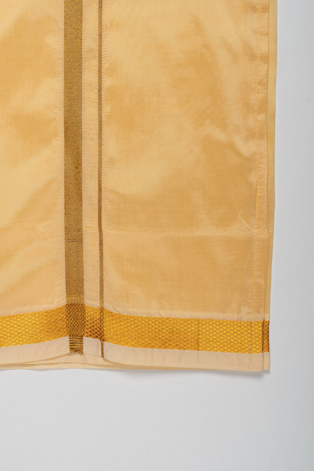 The Nesavu Boys Vesti Traditional Golden Silk Dhoti for Boys with Elegant Border Detailing Nesavu Elegant Golden Silk Dhoti for Boys | Traditional Wear Online | The Nesavu