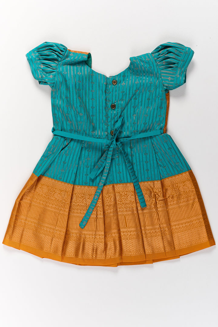 The Nesavu Girls Kanchi Silk Frock Traditional Green and Gold Pattu Pavadai for Girls with Intricate Zari Borders Nesavu Nesavu Traditional Green Gold Pattu Pavadai Girls Zari Borders