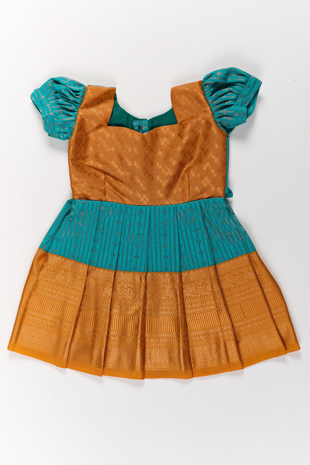 The Nesavu Girls Kanchi Silk Frock Traditional Green and Gold Pattu Pavadai for Girls with Intricate Zari Borders Nesavu Nesavu Traditional Green Gold Pattu Pavadai Girls Zari Borders