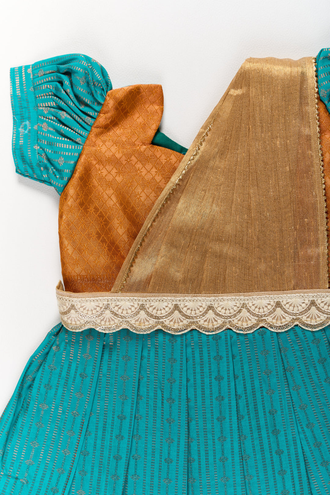 The Nesavu Girls Kanchi Silk Frock Traditional Green and Gold Pattu Pavadai for Girls with Intricate Zari Borders Nesavu Nesavu Traditional Green Gold Pattu Pavadai Girls Zari Borders