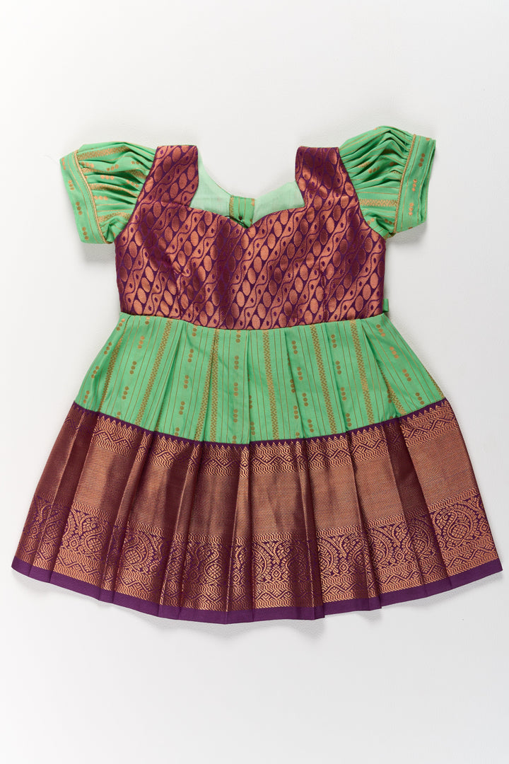 The Nesavu Girls Kanchi Silk Frock Traditional Green and Maroon Pattu Pavadai for Girls with Golden Zari Borders Nesavu Nesavu Traditional Green Maroon Pattu Pavadai Girls Golden Zari Borders