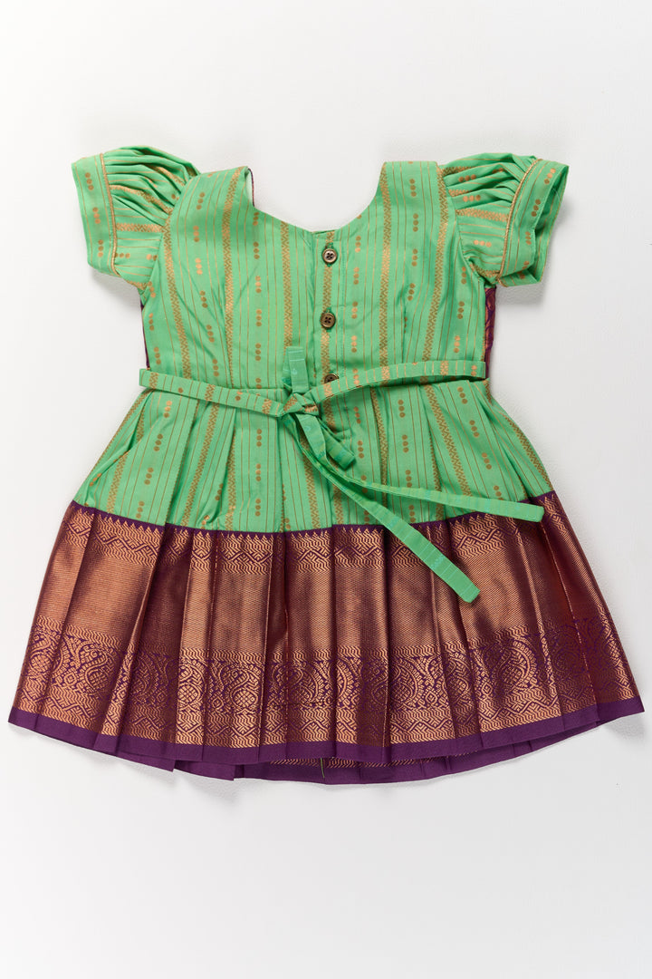 The Nesavu Girls Kanchi Silk Frock Traditional Green and Maroon Pattu Pavadai for Girls with Golden Zari Borders Nesavu Nesavu Traditional Green Maroon Pattu Pavadai Girls Golden Zari Borders