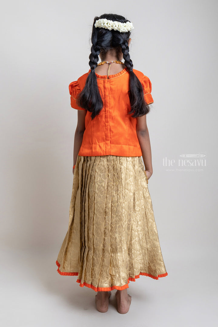 The Nesavu Pattu Pavadai Traditional Orange Silk Blouse With Beige Banarasi Pleated Designer Pattu Pavadai For Girls Nesavu Silk Pavada For Girls | Premium Silk Frock Onine | The Nesavu