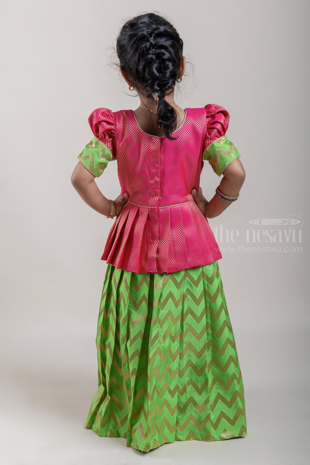 The Nesavu Pattu Pavadai Traditional Pink Brocade Designer Silk Blouse with Green Silk Skirt for Girls Nesavu Ethnic Pink Brocade Silk Blouse with Green Silk Skirt | Traditional Pattu Pavadai |The Nesavu