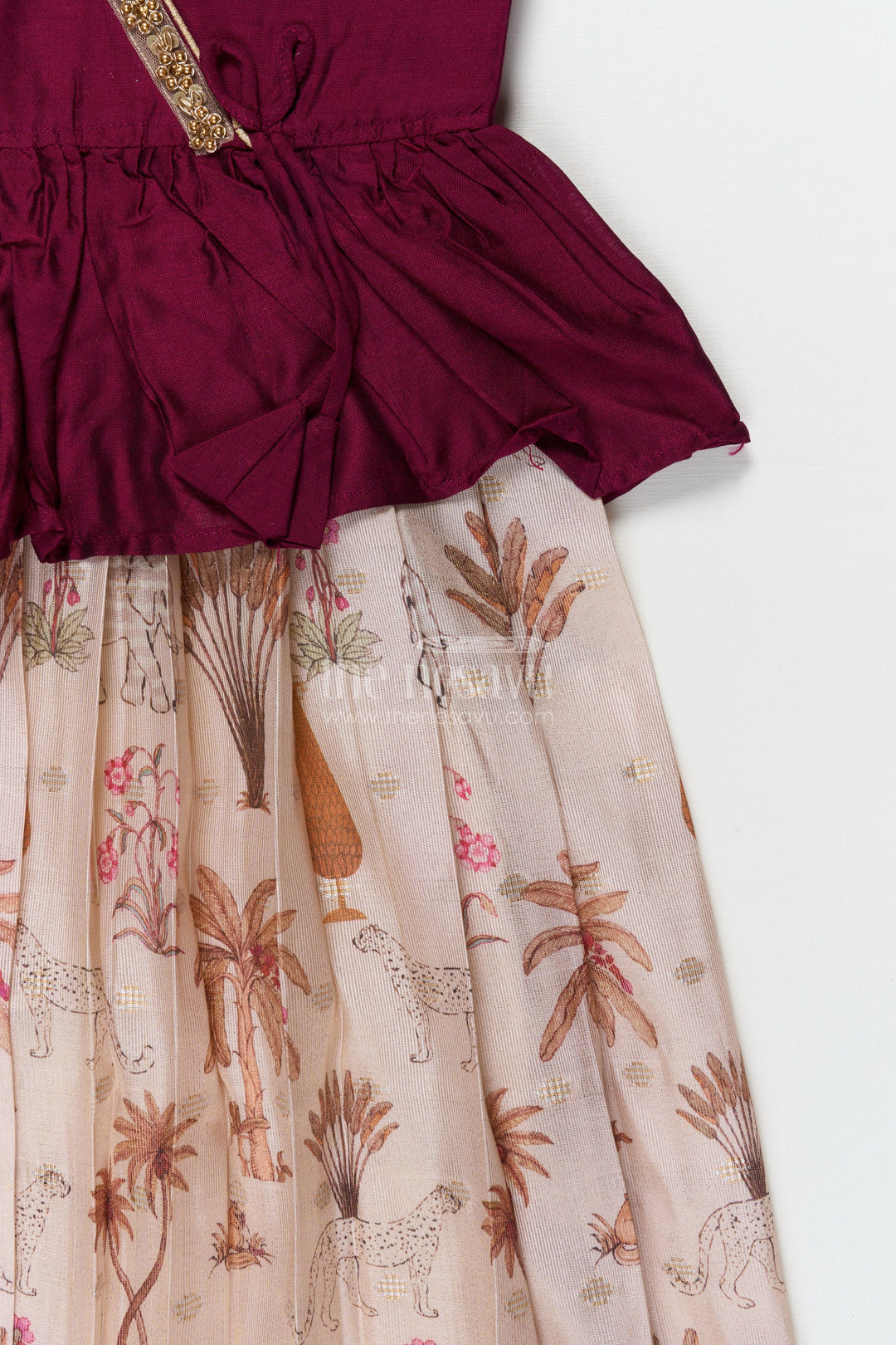 The Nesavu Pattu Pavadai Traditional Wrap-style Baby Pattu Pavadai for Festive Milestones Nesavu Nesavu wrap-style baby pattu pavadai with jungle print skirt for traditional festivities