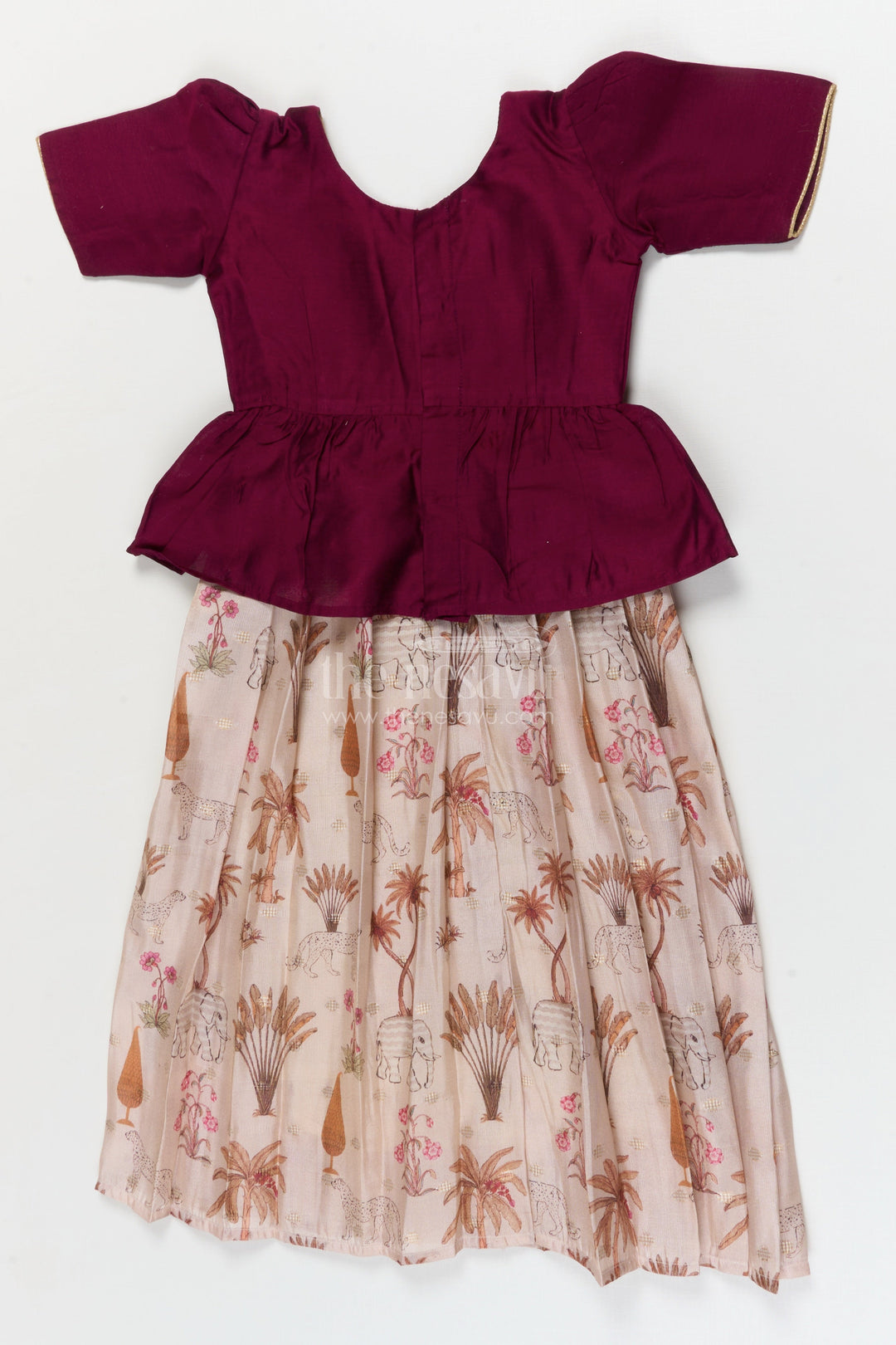 The Nesavu Pattu Pavadai Traditional Wrap-style Baby Pattu Pavadai for Festive Milestones Nesavu Nesavu wrap-style baby pattu pavadai with jungle print skirt for traditional festivities