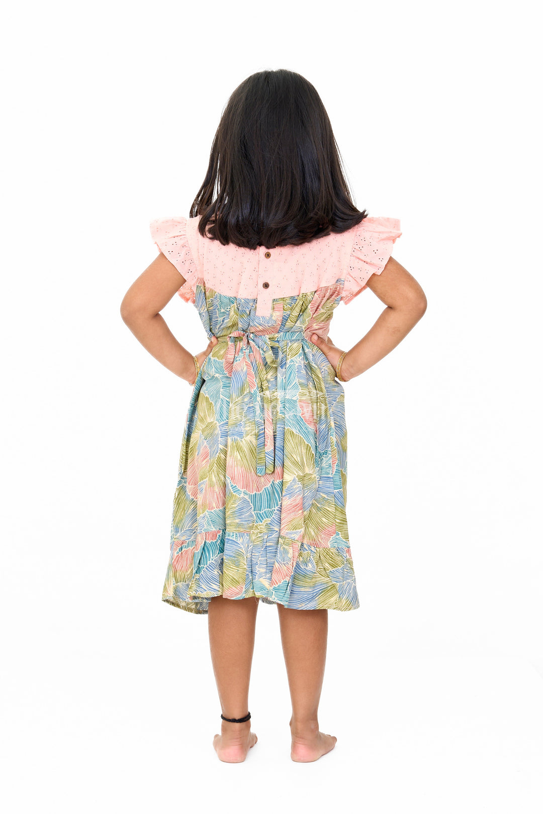 The Nesavu Girls Cotton Frock Trendy Girls Cotton New Dress with Vibrant Leaf Print and Lace Yoke Nesavu Nesavu Girls Cotton New Dress Bold Leaf Print Flutter Sleeves Lace Detailing