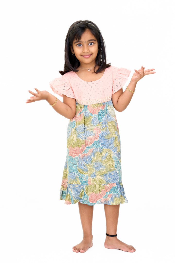 The Nesavu Girls Cotton Frock Trendy Girls Cotton New Dress with Vibrant Leaf Print and Lace Yoke Nesavu Nesavu Girls Cotton New Dress Bold Leaf Print Flutter Sleeves Lace Detailing