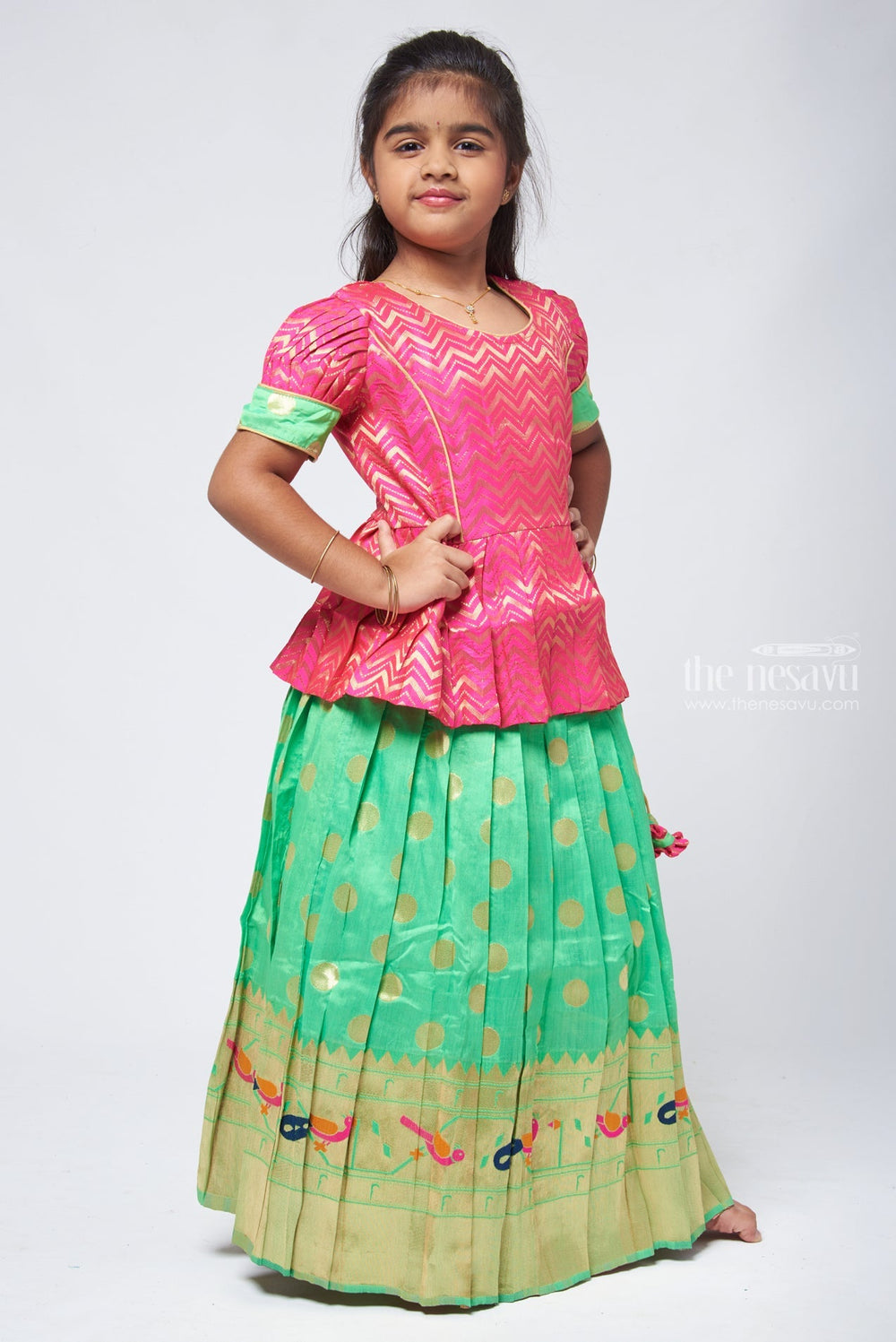 The Nesavu Pattu Pavadai Trendy Zig Zag Pink Peplum Blouse with Zari Butta Green Pattu Pavadai: Heritage Silk Collection Nesavu Pattu Pavadai with zari border | Pattu Pavadai Online Shopping | The Nesavu