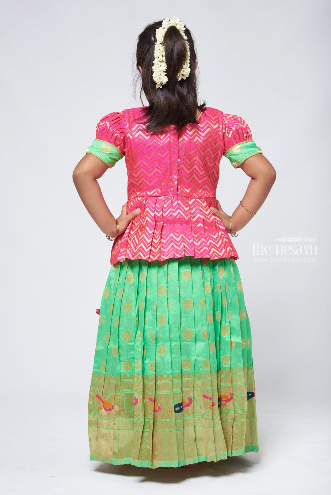 The Nesavu Pattu Pavadai Trendy Zig Zag Pink Peplum Blouse with Zari Butta Green Pattu Pavadai: Heritage Silk Collection Nesavu Pattu Pavadai with zari border | Pattu Pavadai Online Shopping | The Nesavu