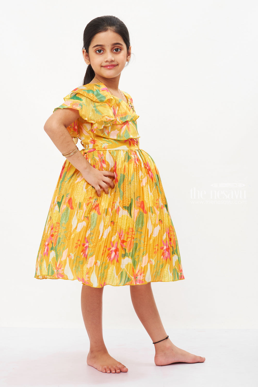 The Nesavu Silk Party Frock Vibrant Floral Girls Silk Party Frock-A Festive Ensemble for Ugadi and Eid Nesavu Traditional Pattu-Inspired Girls Silk Party Dress | Festive Occasion Wear for Kids | The Nesavu