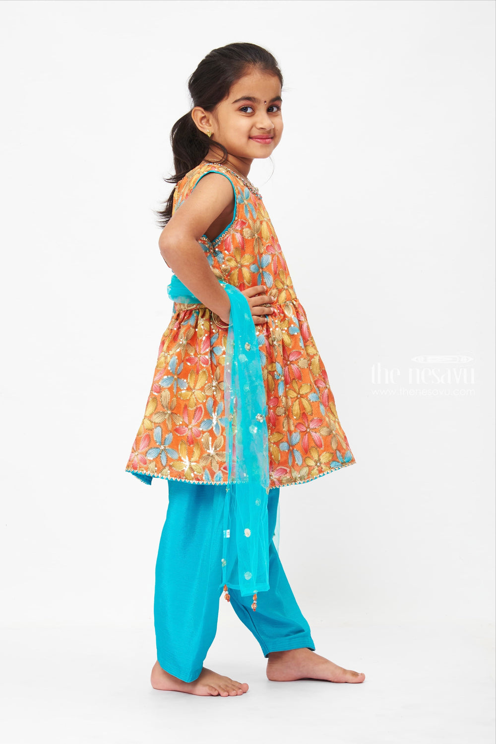 The Nesavu Girls Sharara / Plazo Set Vibrant Floral Peplum Top with Teal Dhoti Pant Set for Girls Nesavu Girls Vibrant Floral Peplum Top with Teal Dhoti Pants | Colorful Ethnic Set | The Nesavu