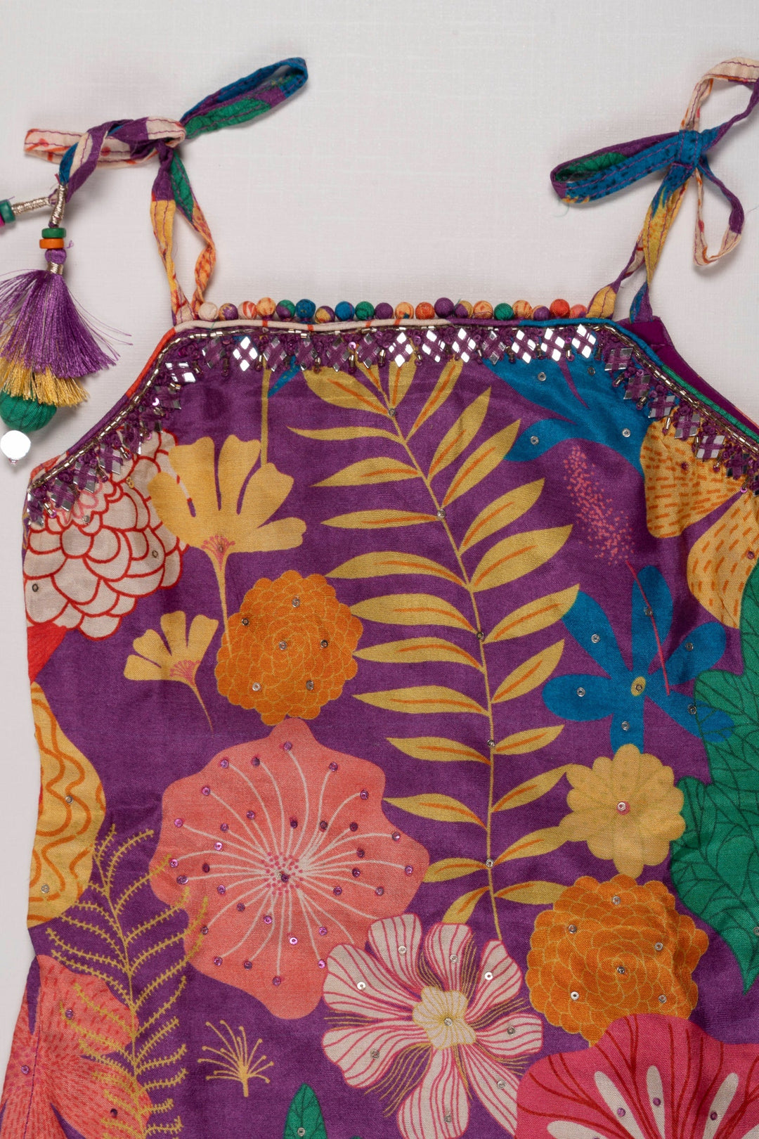 The Nesavu Girls Sharara / Plazo Set Vibrant Floral Print Girls Gharara Set with Tassel Accents Nesavu Shop Floral Gharara Set for Girls Online | Colorful Summer Ethnic Wear | The Nesavu