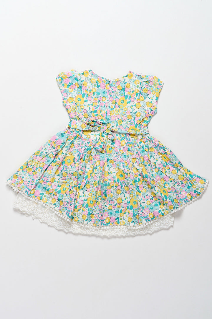 The Nesavu Girls Cotton Frock Vibrant Girls Cotton Frock with Multicolor Floral Print and Lace Hem – Frock for Reception Nesavu Nesavu Girls Cotton Frock Multicolor Floral Print Lace Trim  Ideal Frock Reception