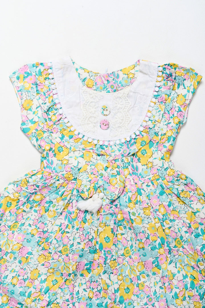 The Nesavu Girls Cotton Frock Vibrant Girls Cotton Frock with Multicolor Floral Print and Lace Hem Frock for Reception Nesavu Nesavu Girls Cotton Frock Multicolor Floral Print Lace Trim  Ideal Frock Reception