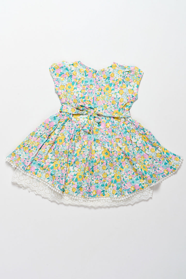 The Nesavu Girls Cotton Frock Vibrant Girls Cotton Frock with Multicolor Floral Print and Lace Hem – Frock for Reception Nesavu Nesavu Girls Cotton Frock Multicolor Floral Print Lace Trim  Ideal Frock Reception