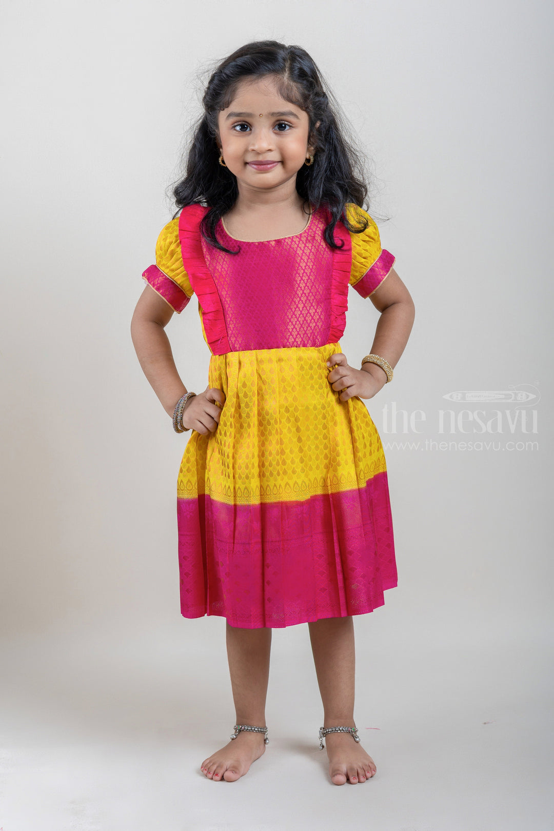 The Nesavu Girls Kanchi Silk Frock Vibrant Yellow Pink Banarasi Soft Silk / Pattu Frocks For Toddler Girl With Ruffle Yoke Nesavu 18 (2Y) / Yellow / Big Border SF610A Traditional Silk Wear Frock | Latest Kanchi Silk Dress | The Nesavu